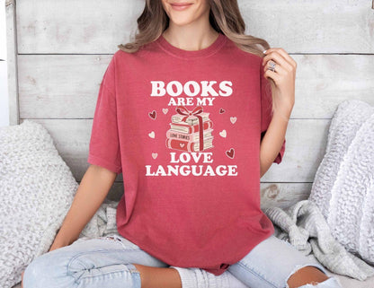  A comfort colors shirt with the saying "books are my love language"