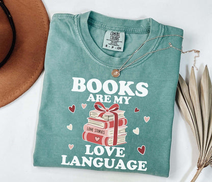  A comfort colors shirt with the saying "books are my love language"