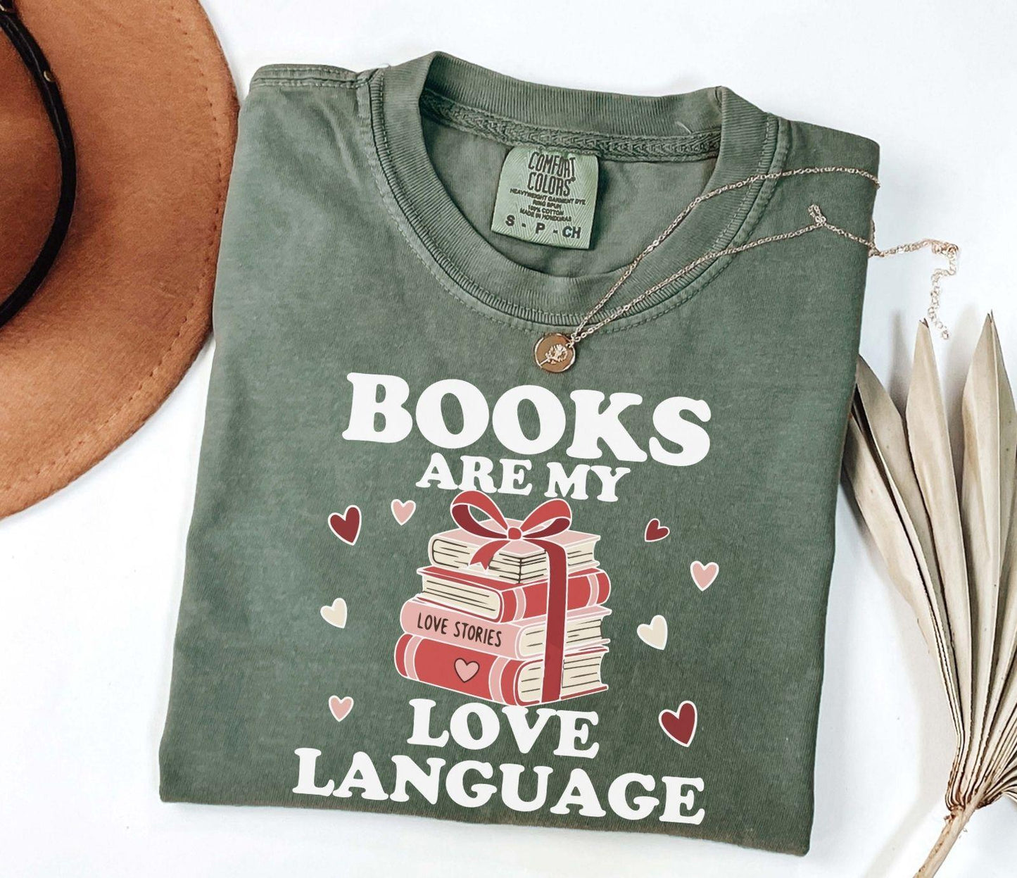  A comfort colors shirt with the saying "books are my love language"