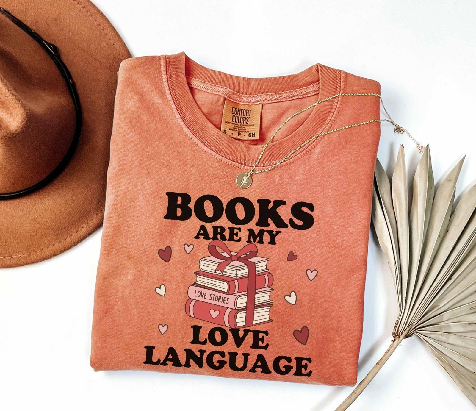  A comfort colors shirt with the saying "books are my love language"