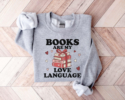 A gildan 18000 sweatshirt with the saying "Books are my love language"