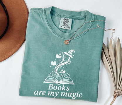 A comfort colors® shirt with the saying "books are my magic"
