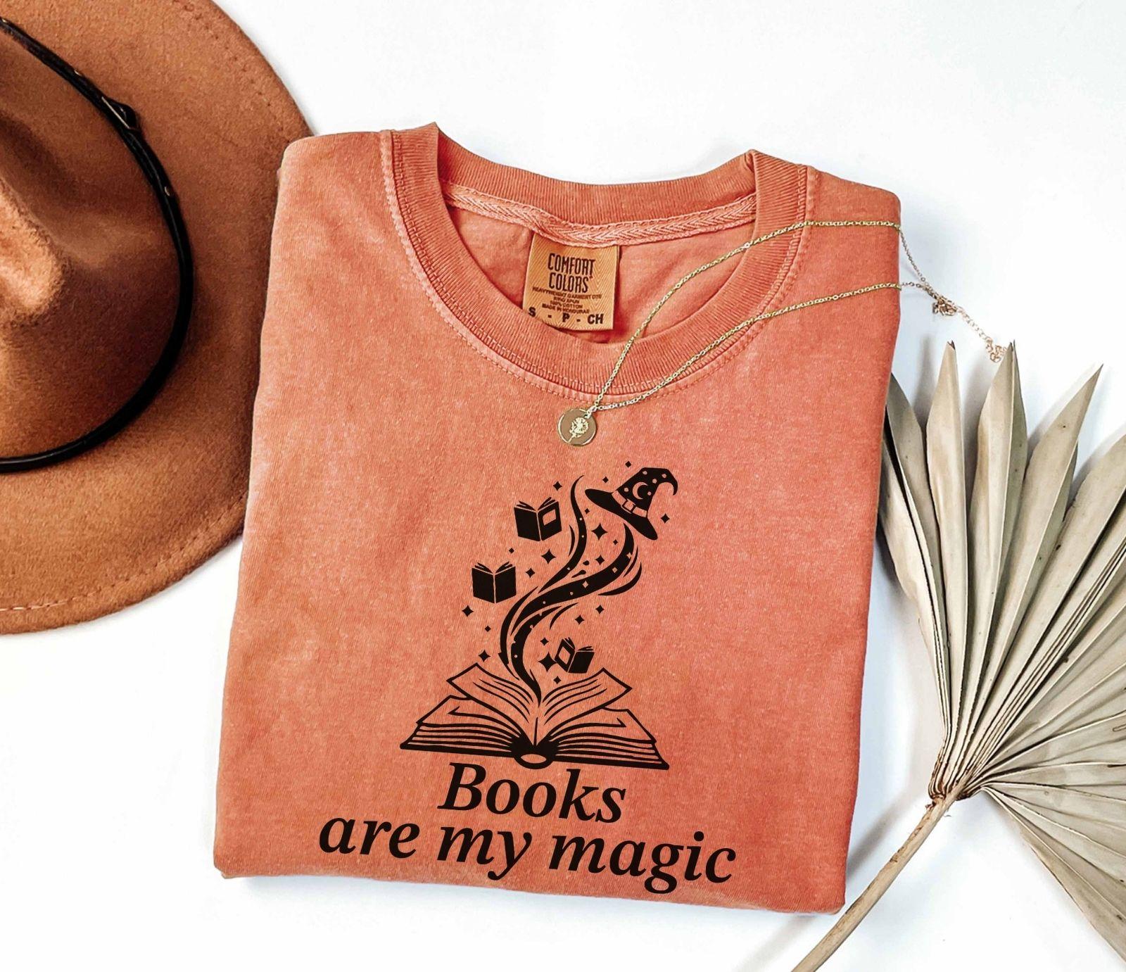 A comfort colors® shirt with the saying "books are my magic"