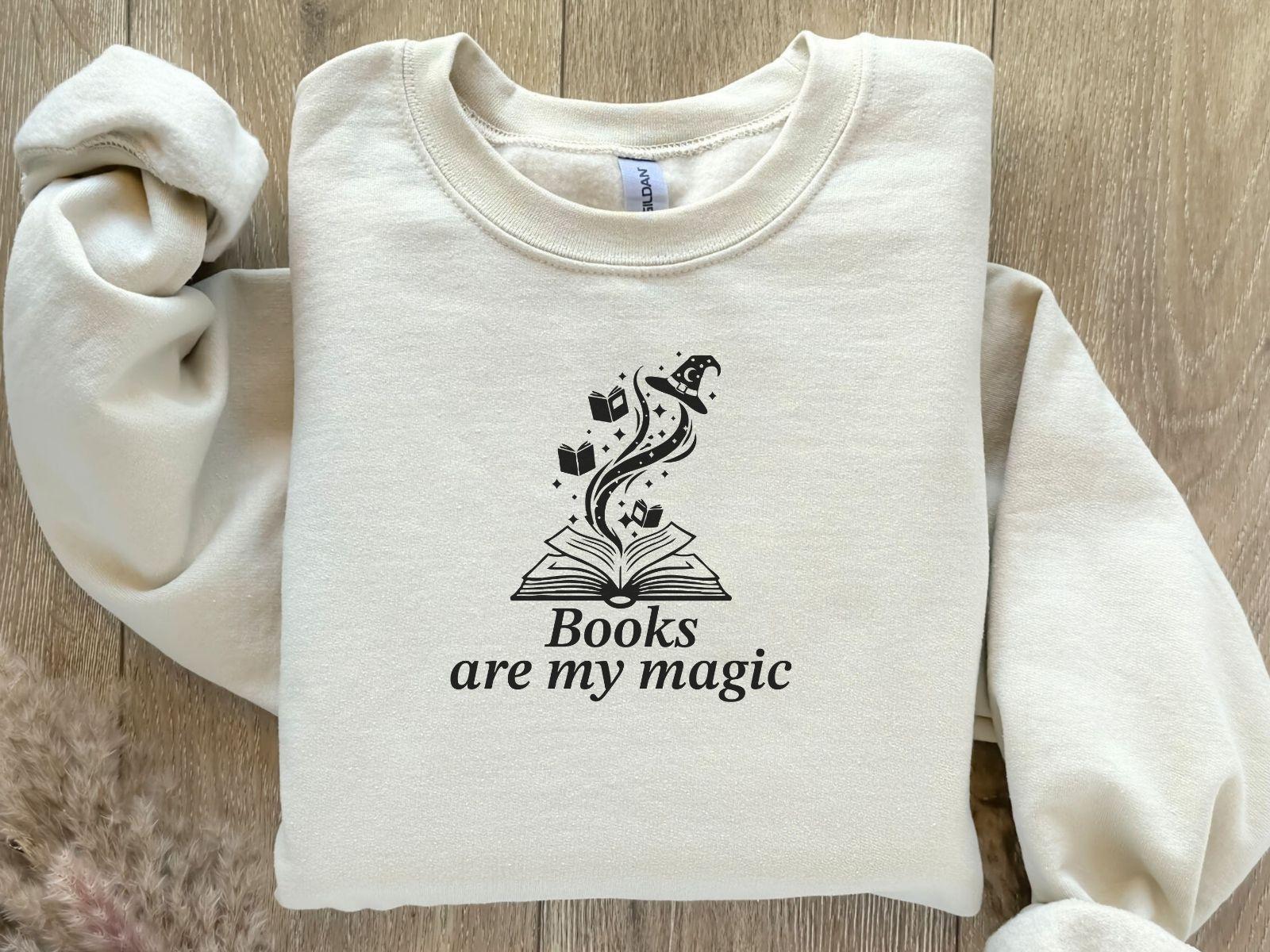 A Gildan 18000 sweatshirt with the saying "books are my magic"