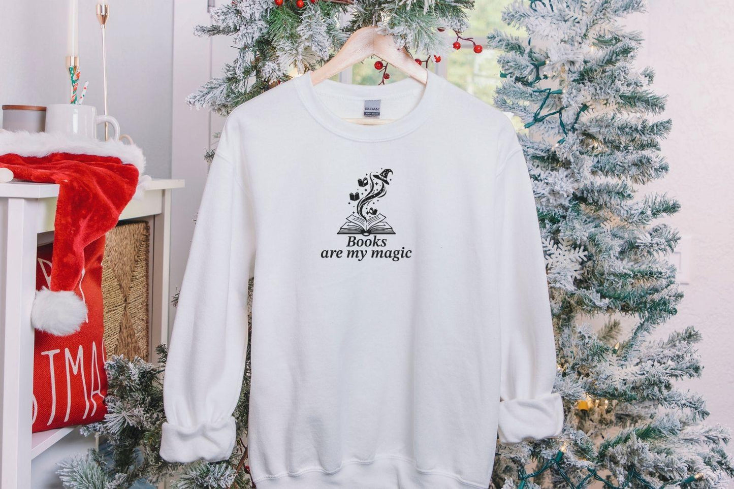 A Gildan 18000 sweatshirt with the saying "books are my magic"