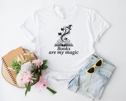A comfort colors® shirt with the saying "books are my magic"