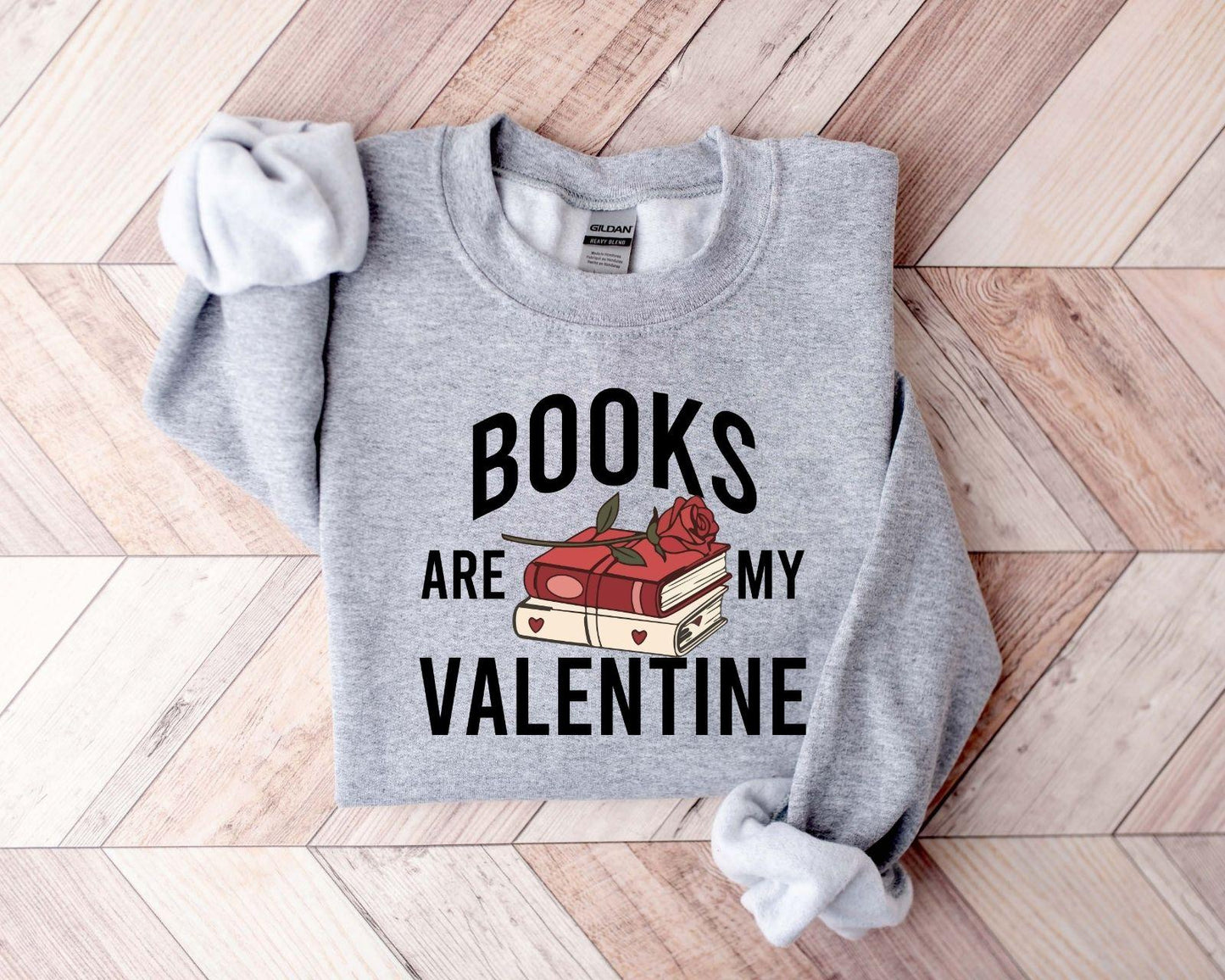 A gildan 18000 sweatshirt with the saying "Books are my velentine"