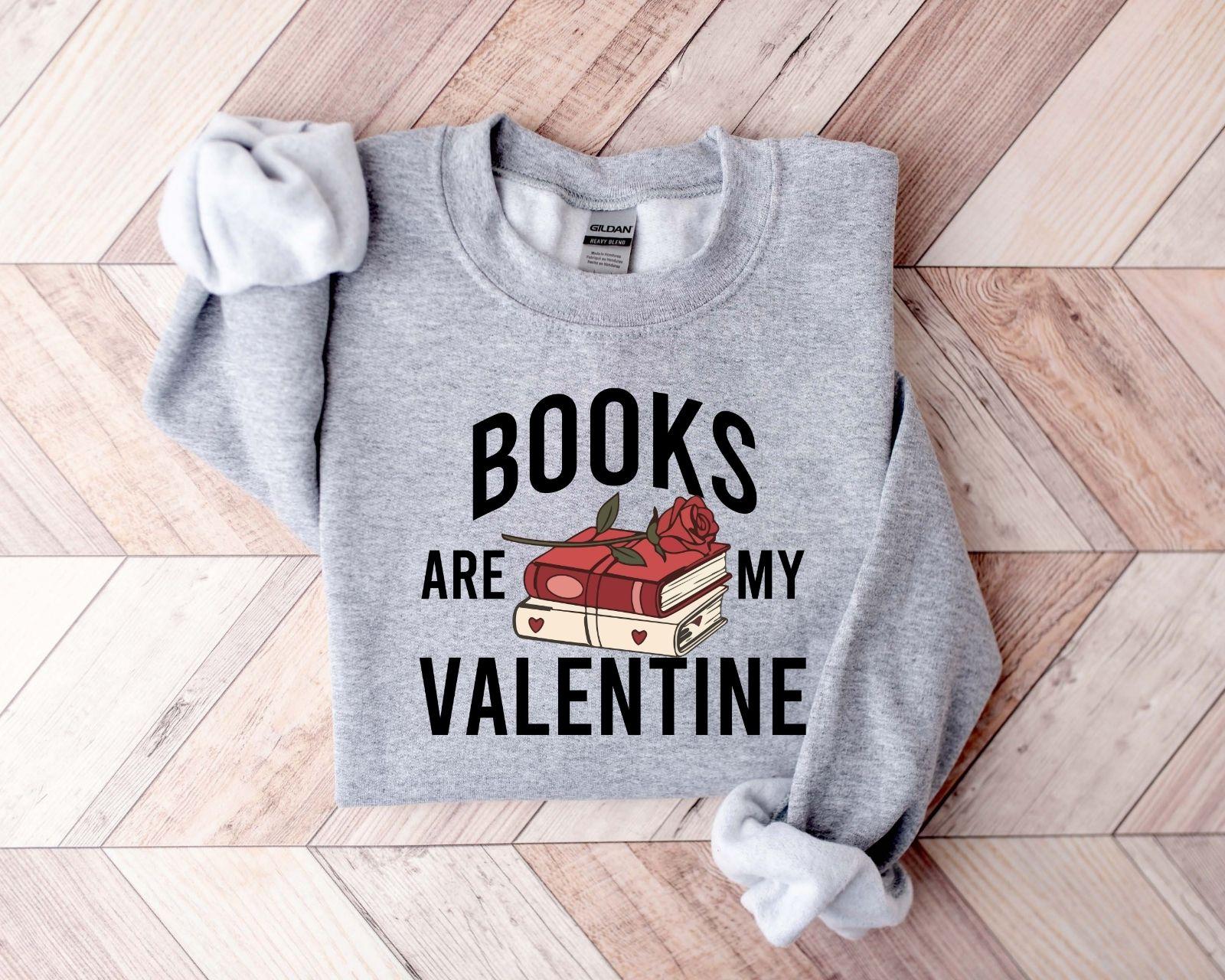 A gildan 18000 sweatshirt with the saying "Books are my velentine"