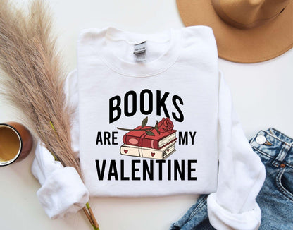 A gildan 18000 sweatshirt with the saying "Books are my velentine"