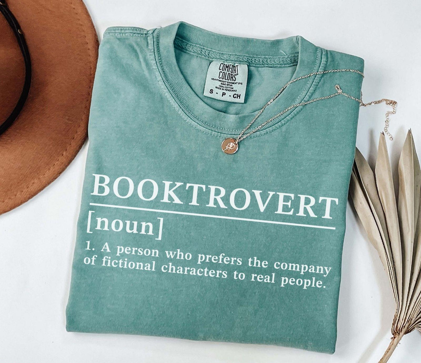 A comfort colors® shirt with the saying "Booktrovert"