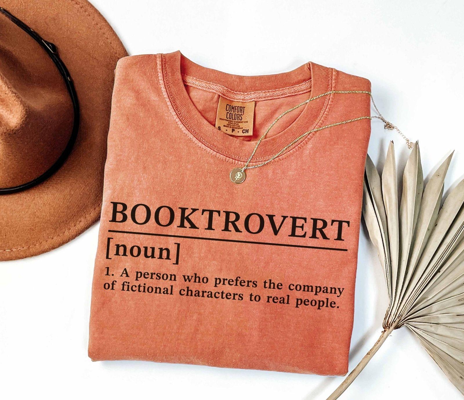 A comfort colors® shirt with the saying "Booktrovert"