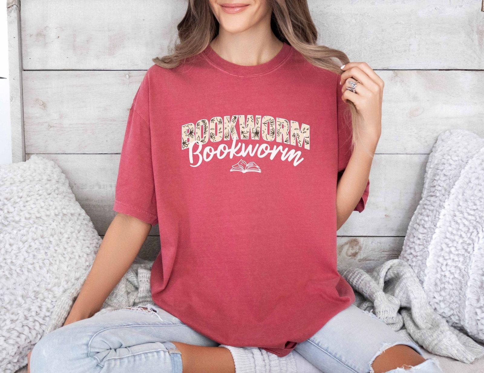 A comfort colors shirt with the saying "Bookworm"