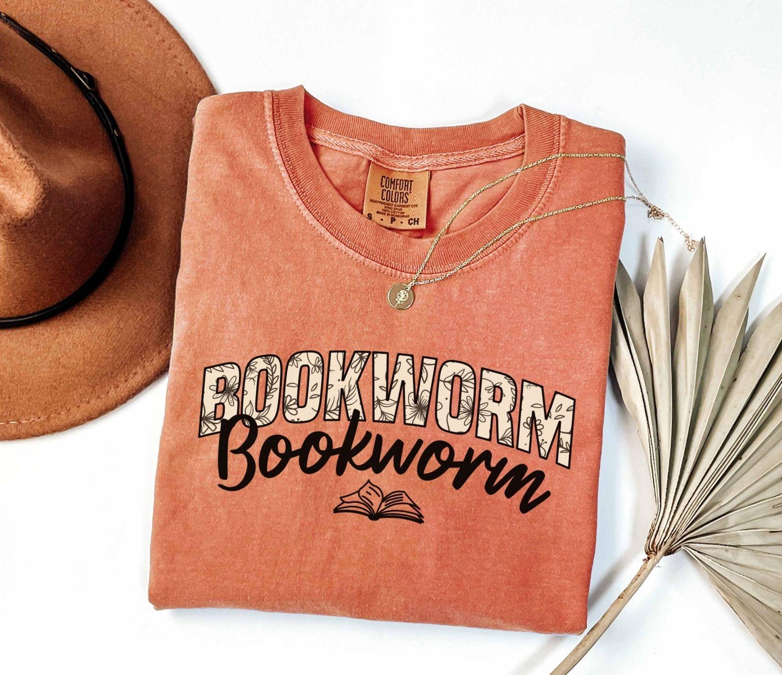 A comfort colors shirt with the saying "Bookworm"