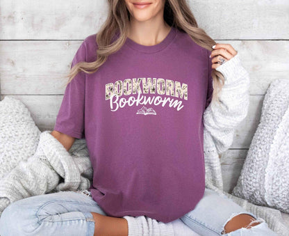 A comfort colors shirt with the saying "Bookworm"