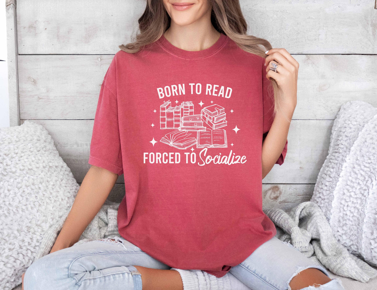 A comfort colors shirt with the saying "Born To Read Forced To socialize"