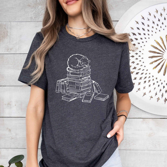 A comfort colors® shirt with the saying "cats and books"