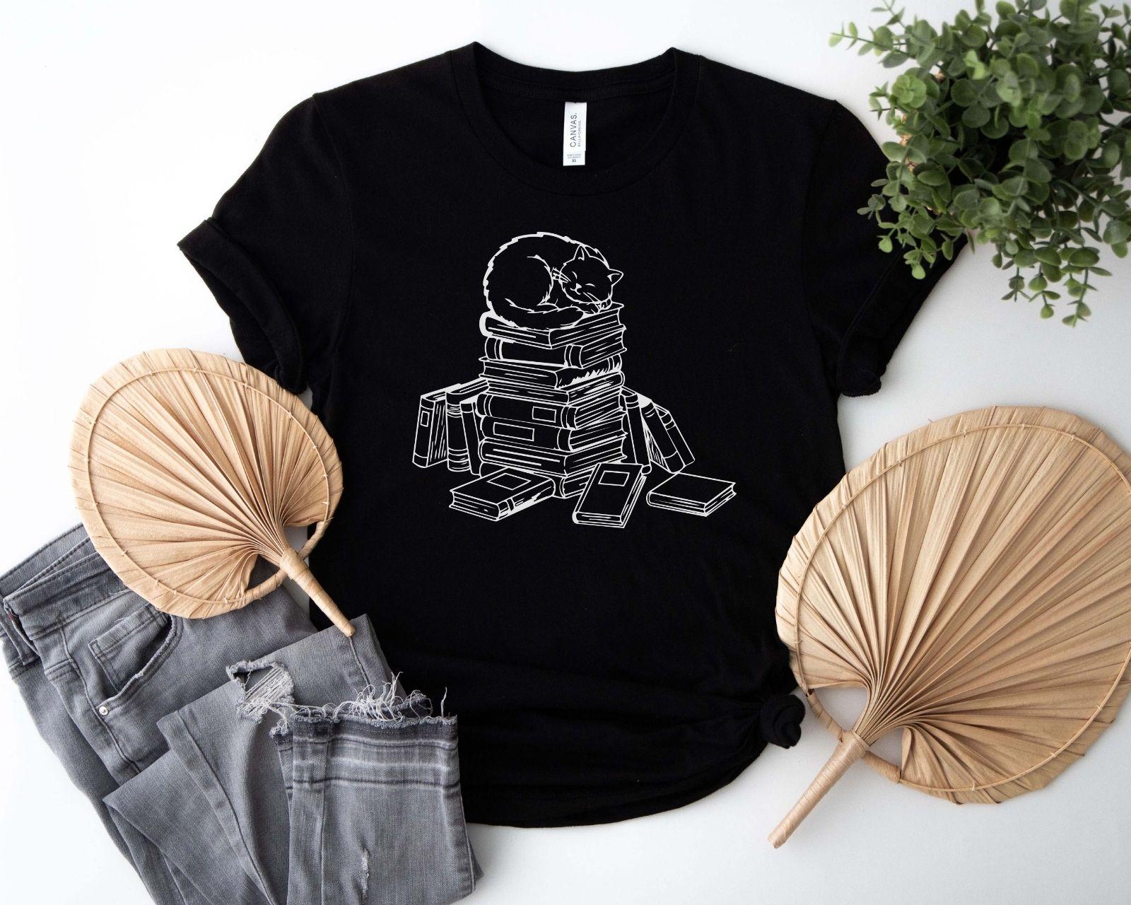 A comfort colors® shirt with the saying "cats and books"