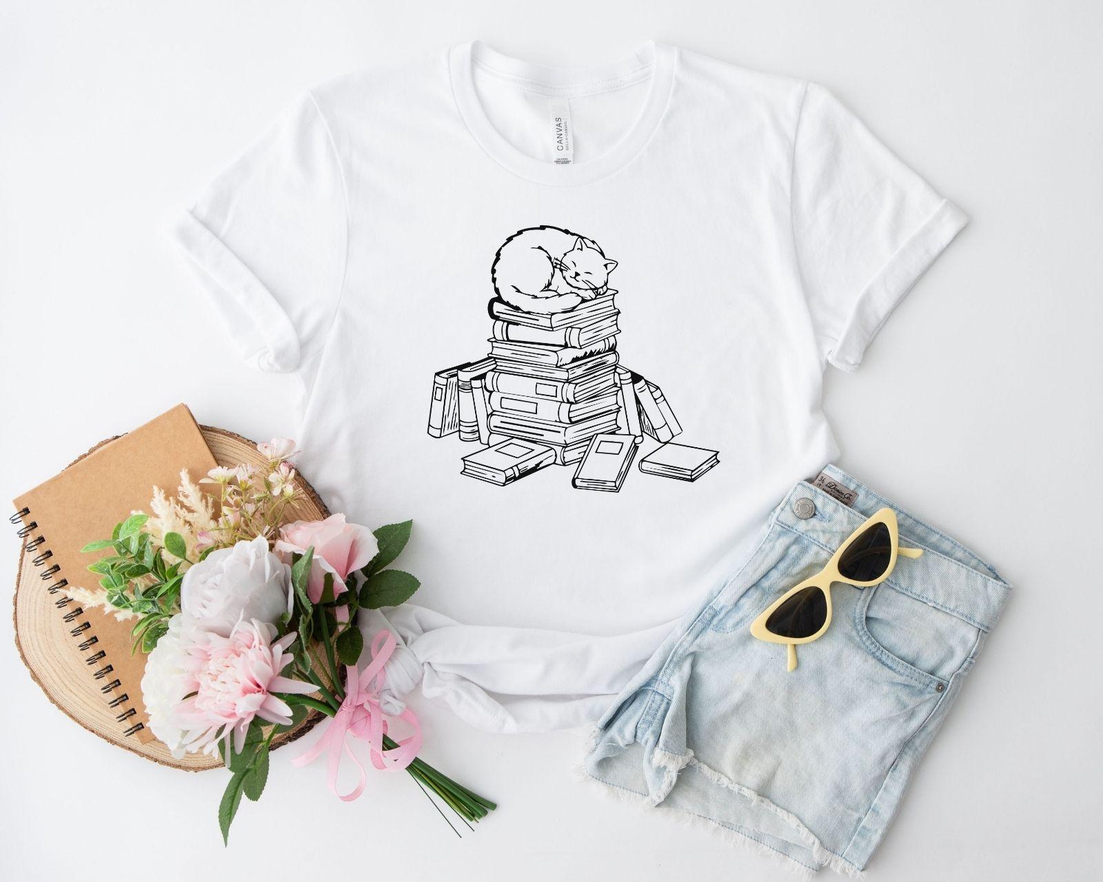 A comfort colors® shirt with the saying "cats and books"