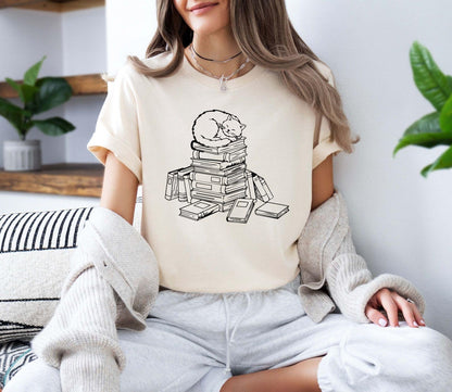 A comfort colors® shirt with the saying "cats and books"