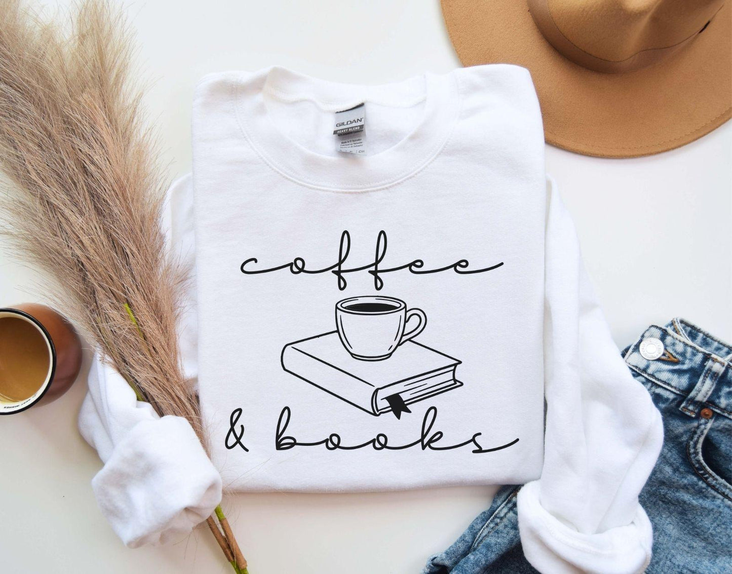 A Gildan 18000 sweatshirt with the saying "coffee and books"