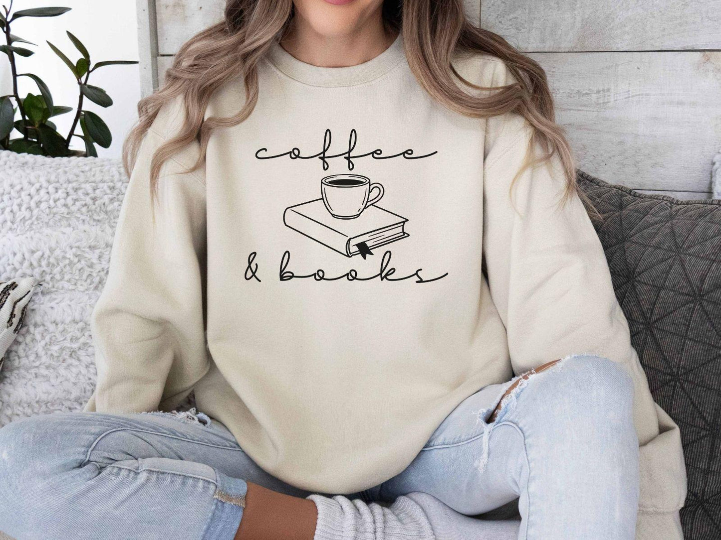 A Gildan 18000 sweatshirt with the saying "coffee and books"