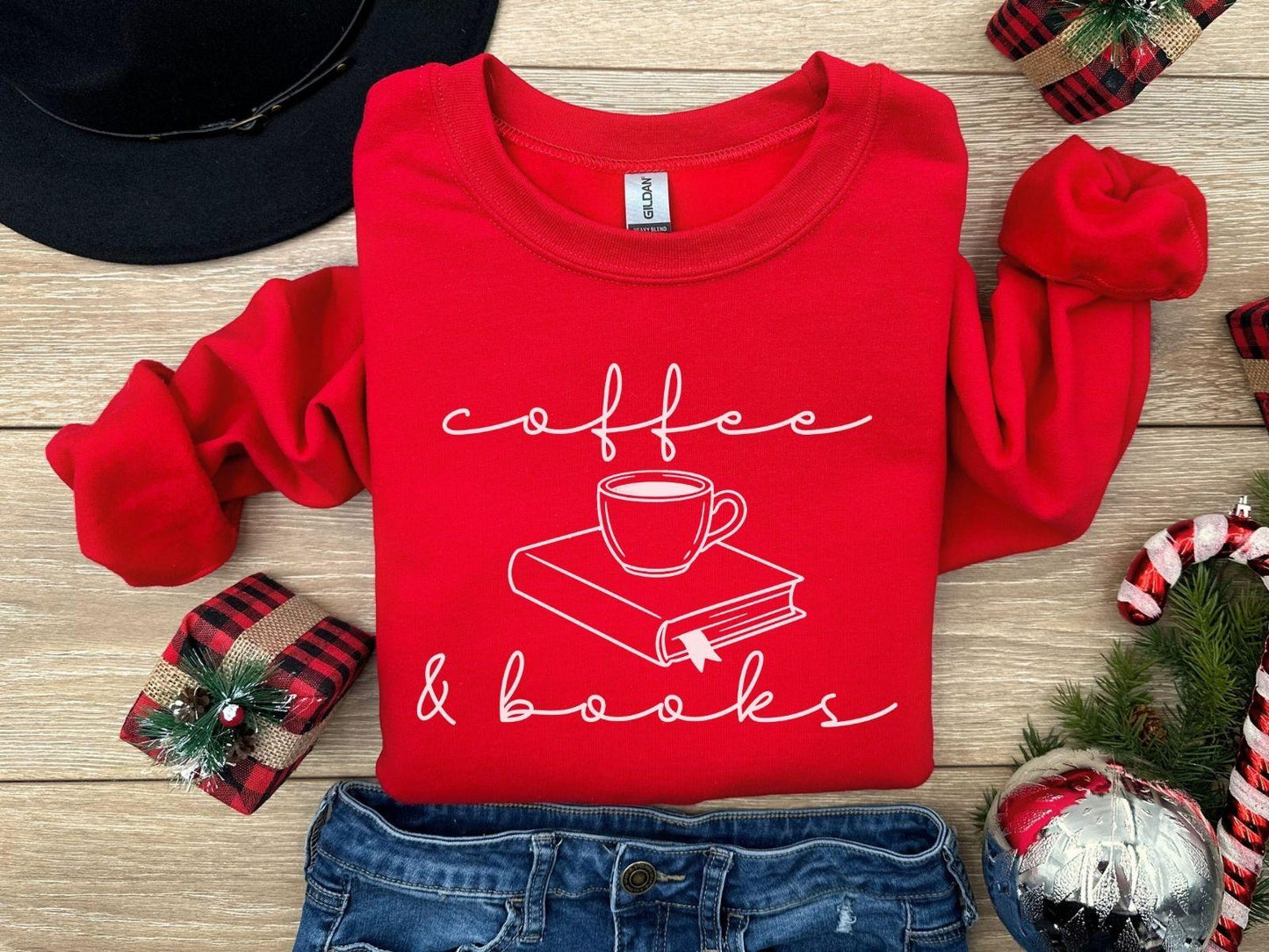 A Gildan 18000 sweatshirt with the saying "coffee and books"
