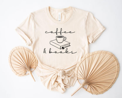 A bella canvas 3001 shirt with the saying "coffee and books"