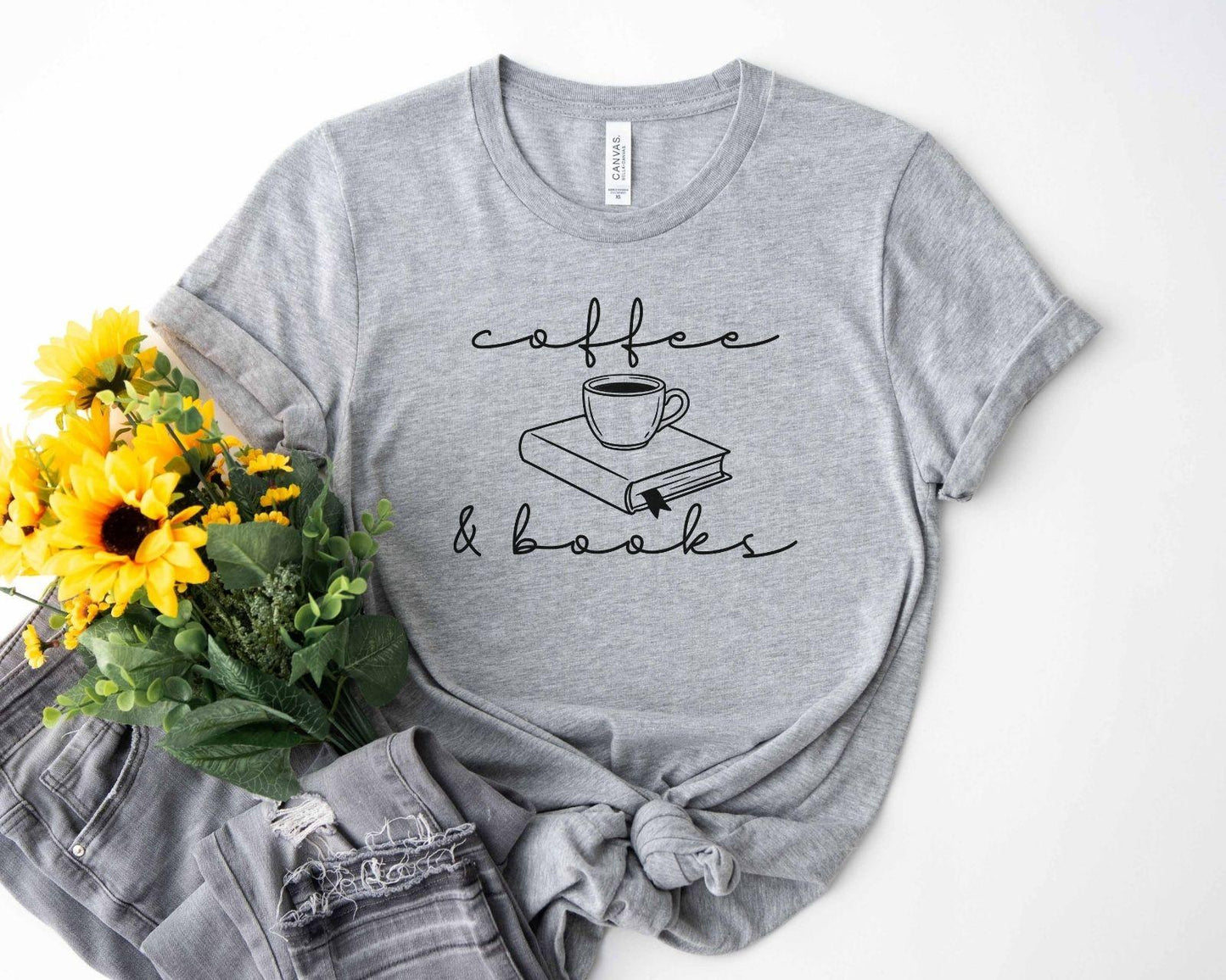 A bella canvas 3001 shirt with the saying "coffee and books"