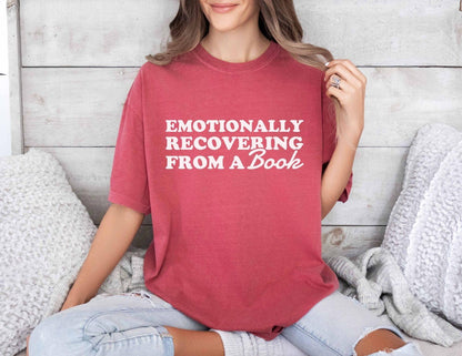 A comfort colors® 1717 shirt with the saying "Emotionally recovering from a book"
