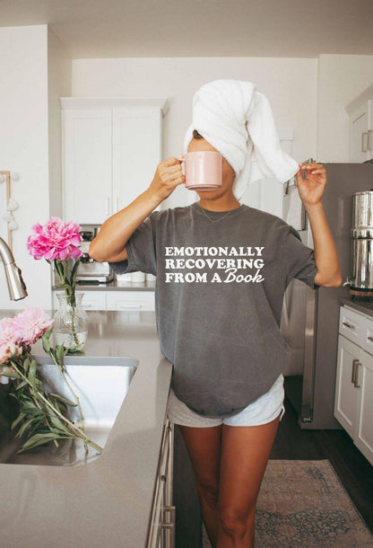 A comfort colors® 1717 shirt with the saying "Emotionally recovering from a book"
