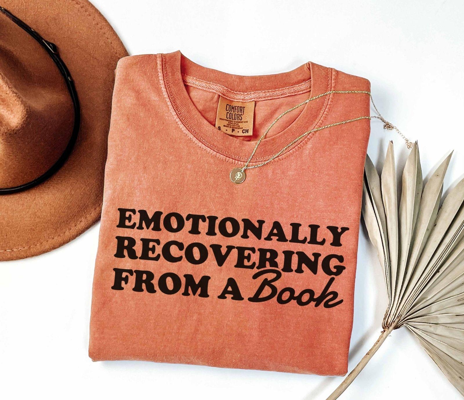A comfort colors® 1717 shirt with the saying "Emotionally recovering from a book"