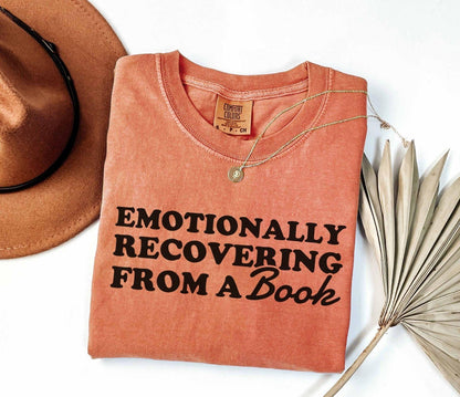 A comfort colors® 1717 shirt with the saying "Emotionally recovering from a book"