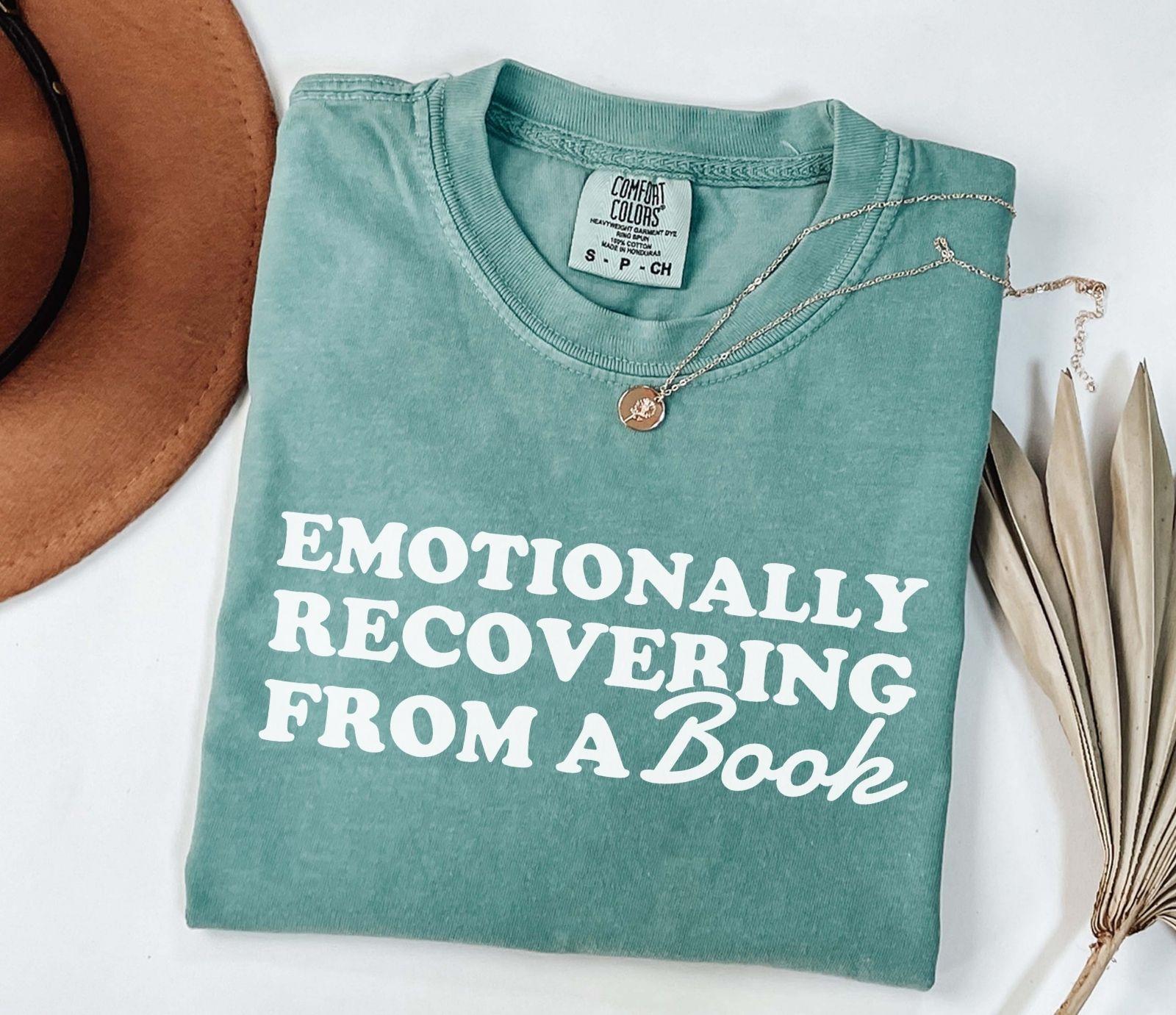 A comfort colors® 1717 shirt with the saying "Emotionally recovering from a book"