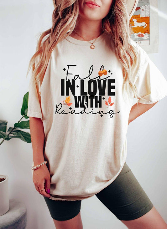 A comfort colors® shirt with the saying "Fall in love with reading"