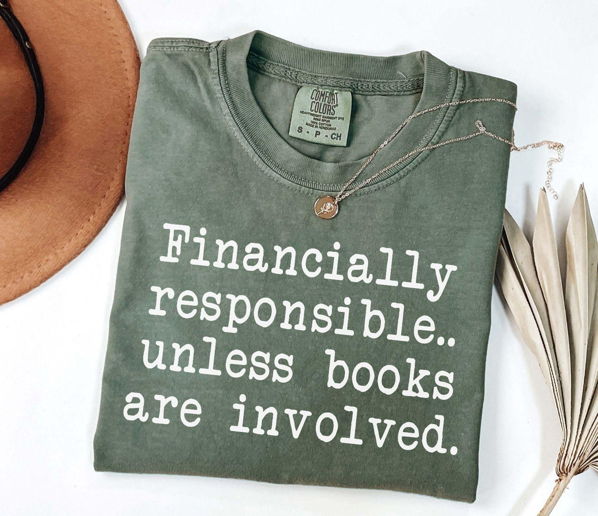 A comfort colors® shirt with the saying "financially responsible unless books are involved"