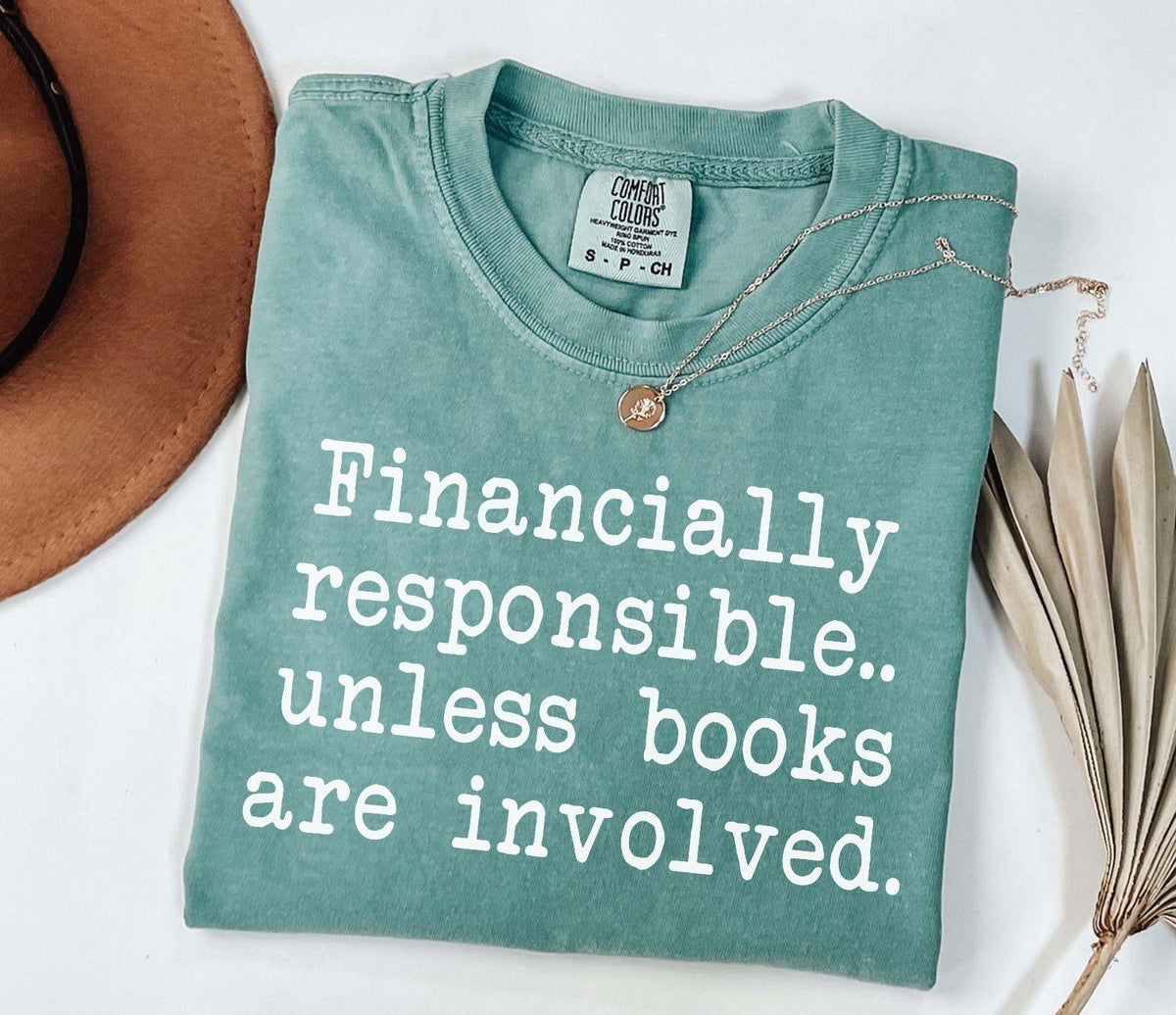 A comfort colors® shirt with the saying "financially responsible unless books are involved"