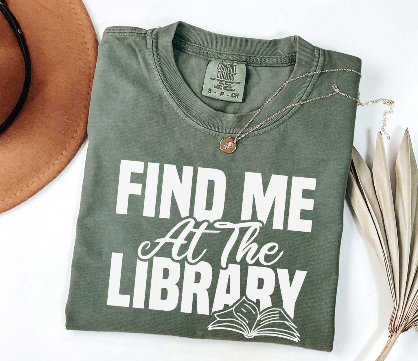 A comfort colors® shirt with the saying "Find me at the library"