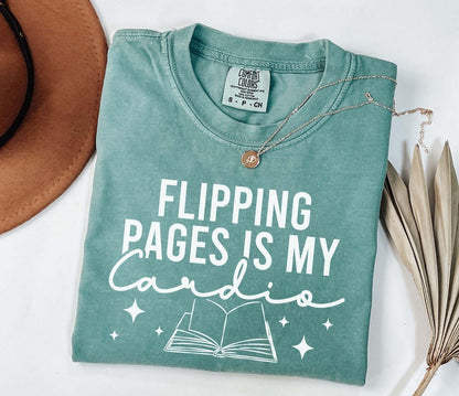 A comfort colors shirt with the saying "Flipping pages is my cardio"