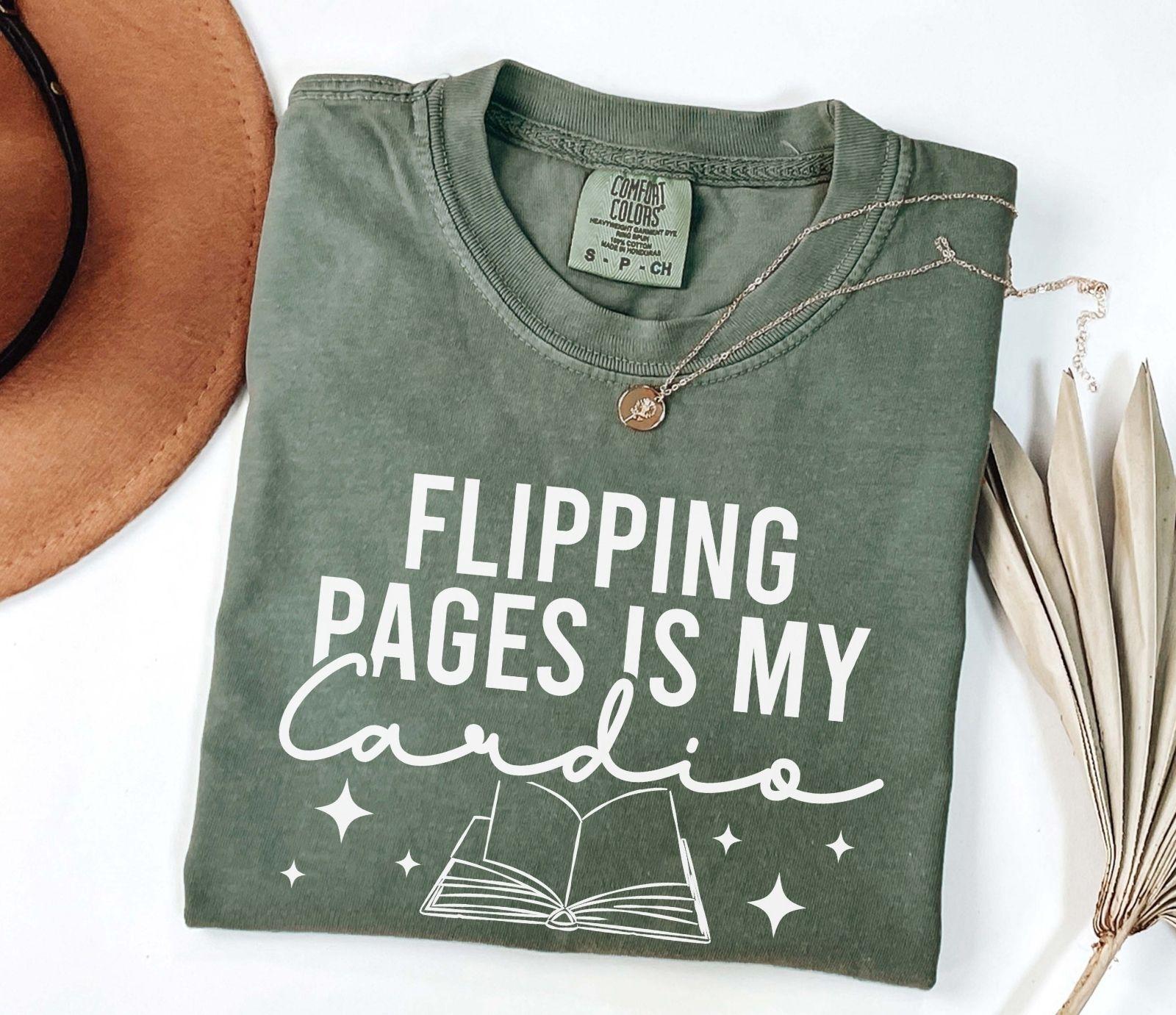 A comfort colors shirt with the saying "Flipping pages is my cardio"
