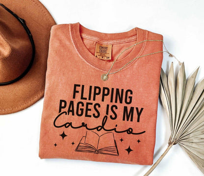 A comfort colors shirt with the saying "Flipping pages is my cardio"