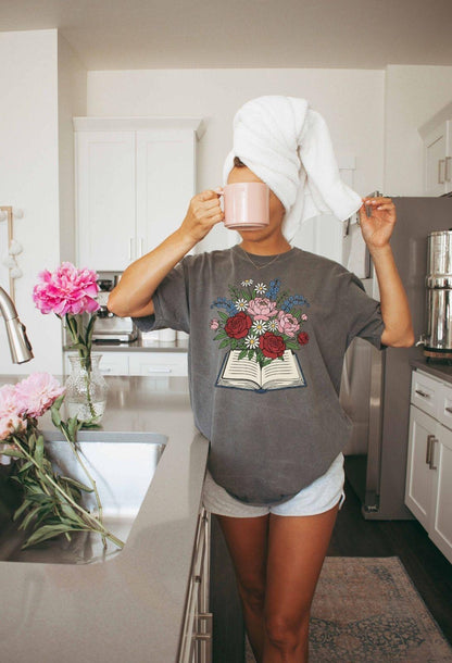 A comfort colors® shirt with the saying "flowered book"