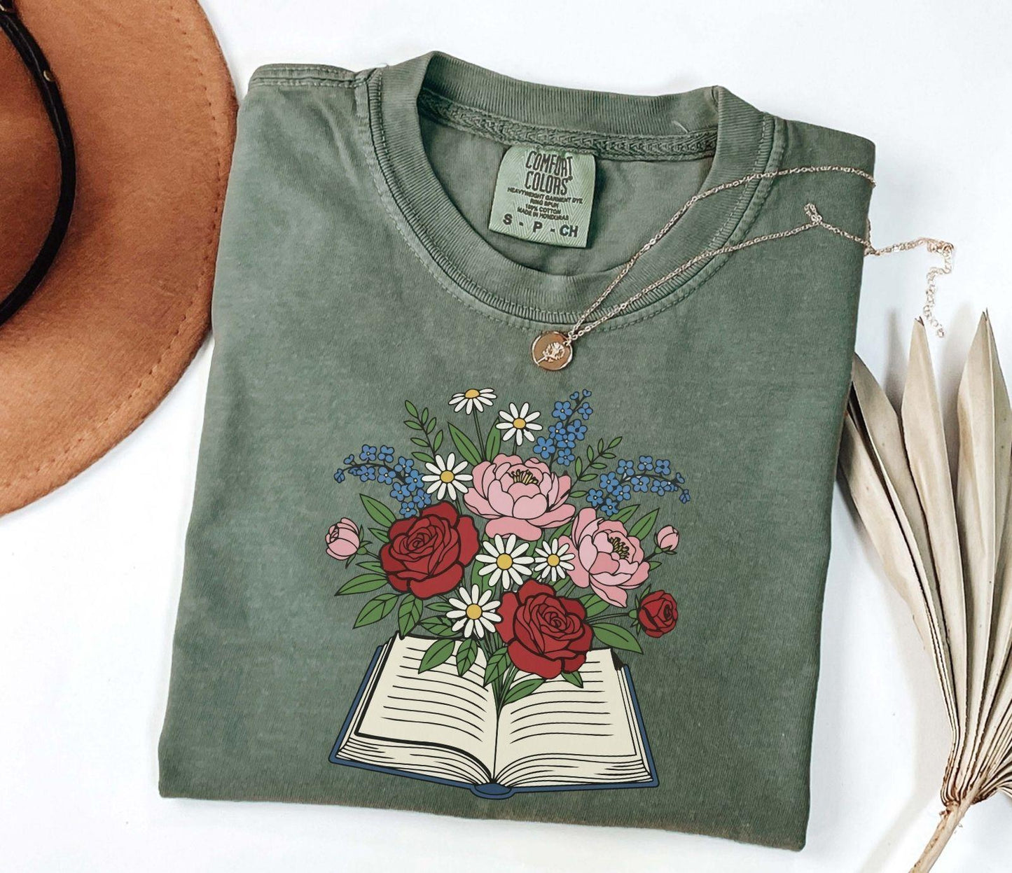 A comfort colors® shirt with the saying "flowered book"