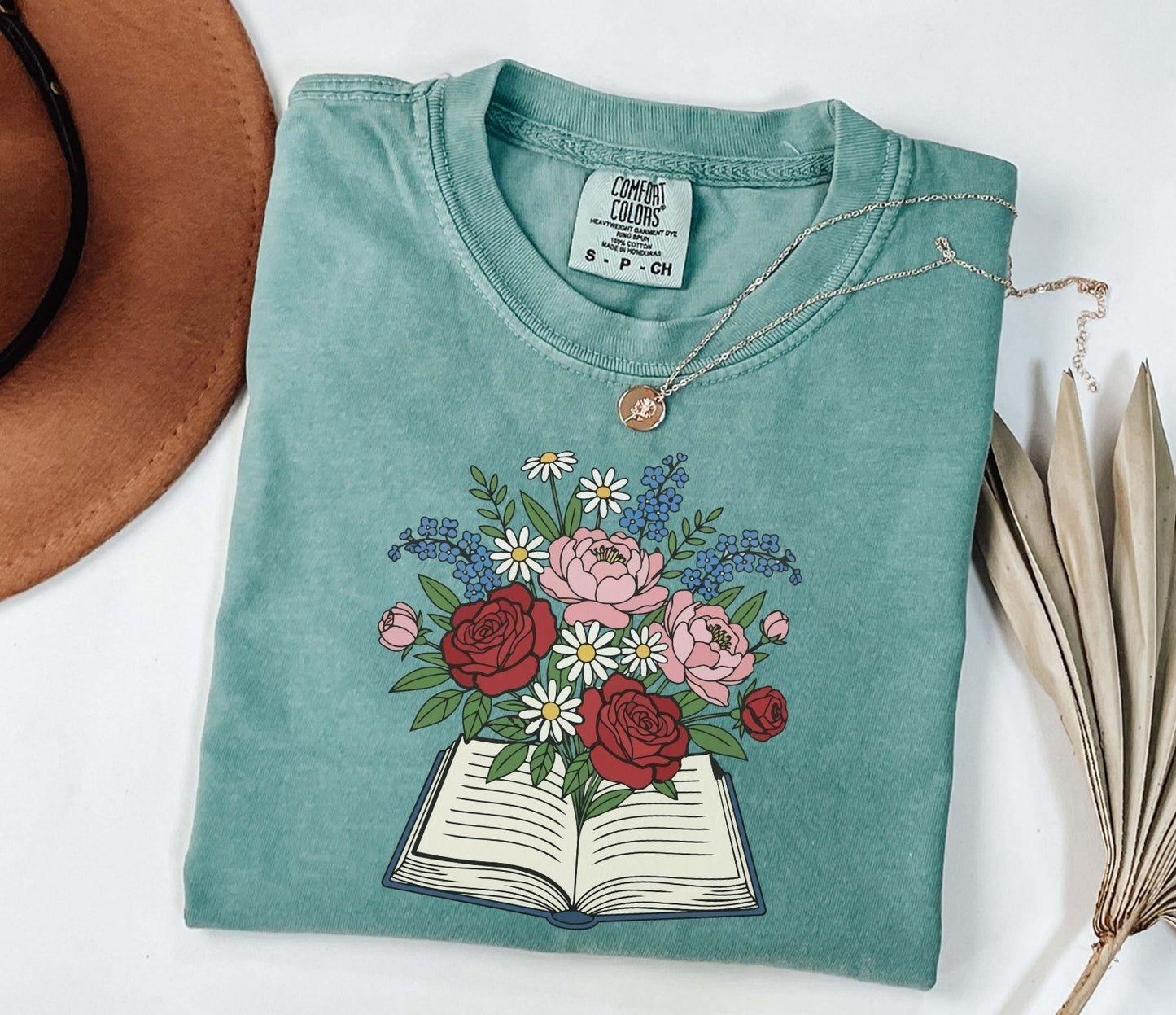 A comfort colors® shirt with the saying "flowered book"