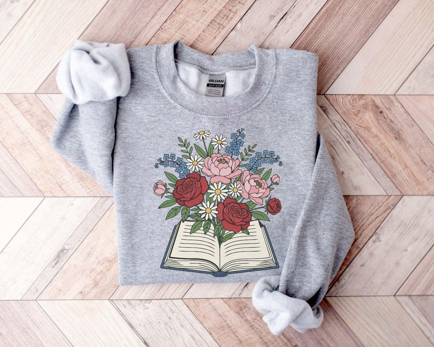 A Gildan 18000 sweatshirt with the saying "flowered"