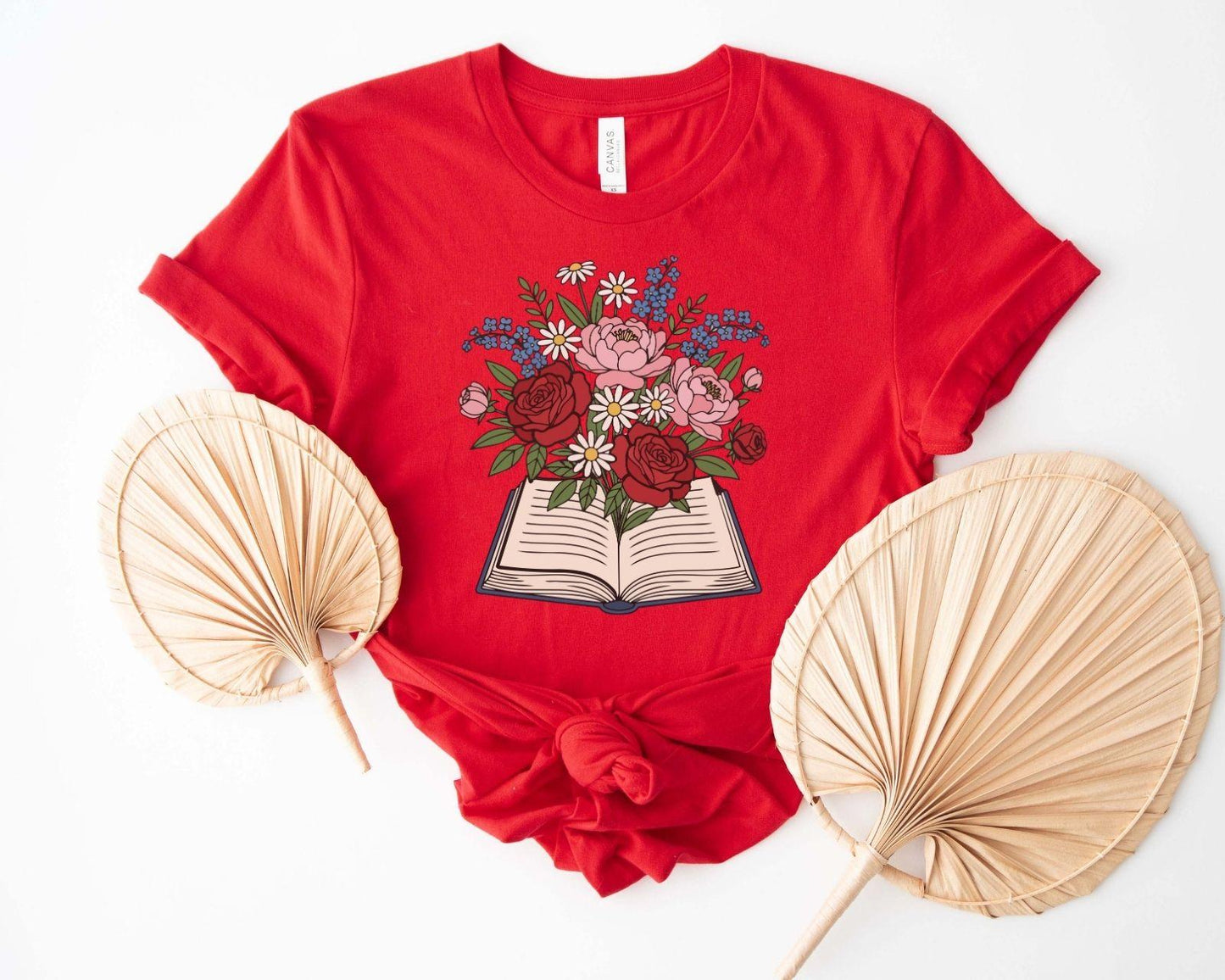 A comfort colors® shirt with the saying "flowered book"