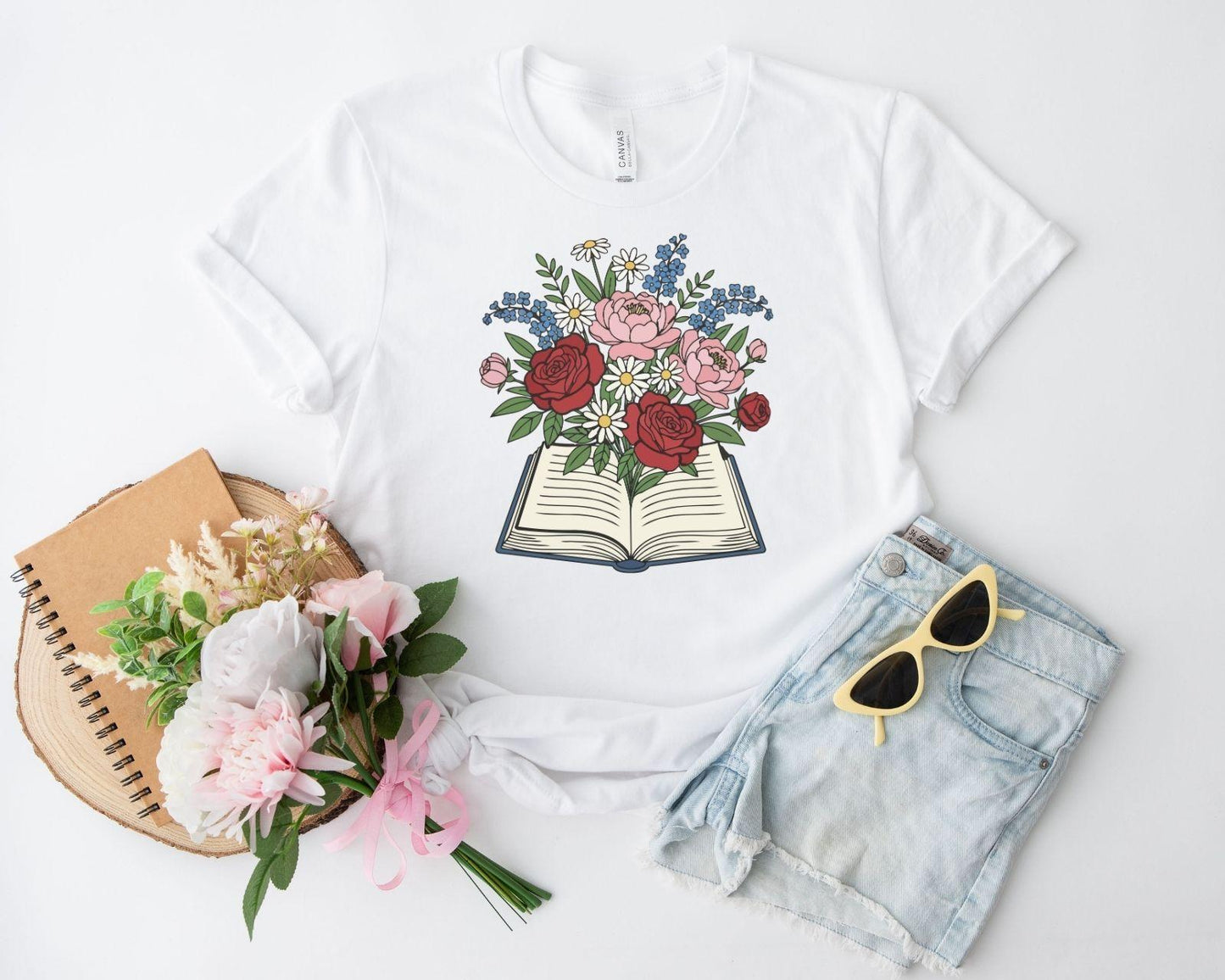 A comfort colors® shirt with the saying "flowered book"