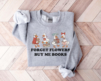 A gildan 18000 sweatshirt with the saying "Forget flowers buy me books"