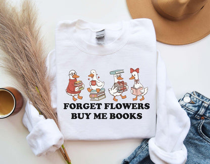 A gildan 18000 sweatshirt with the saying "Forget flowers buy me books"