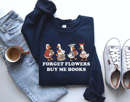 A gildan 18000 sweatshirt with the saying "Forget flowers buy me books"