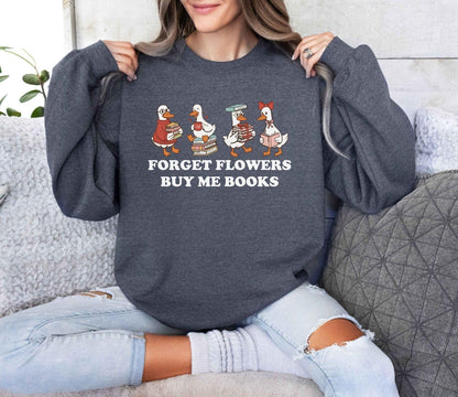 A gildan 18000 sweatshirt with the saying "Forget flowers buy me books"